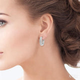 1/10 Ctw Scooped Center Round Cut Diamond Huggie Petite Earrings in 10K White Gold