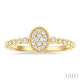 1/8 ctw Petite Bead Shank Oval Center Round Cut Diamond Fashion Ring in 10K Yellow Gold