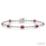 5x3MM Oval Cut Ruby and 1/20 Ctw Single Cut Diamond Bracelet in 14K White Gold