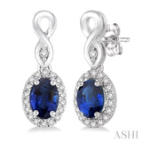5x3 MM Oval Cut Sapphire and 1/6 Ctw Round Cut Diamond Earrings in 10K White Gold